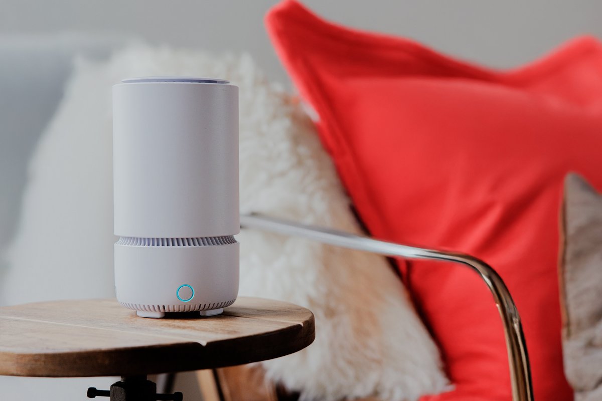 vodafone broadband router pictured on a side table with a red cushion in the background