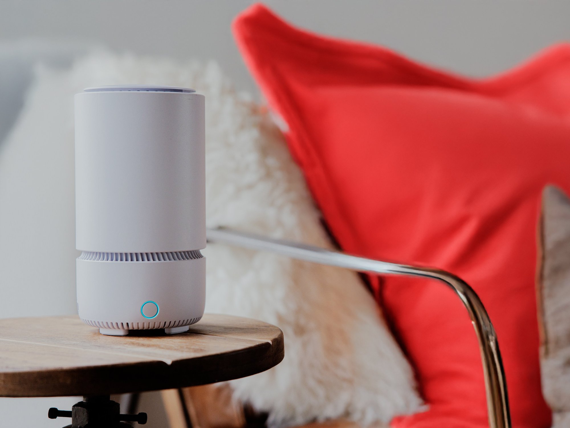 vodafone broadband router pictured on a side table with a red cushion in the background