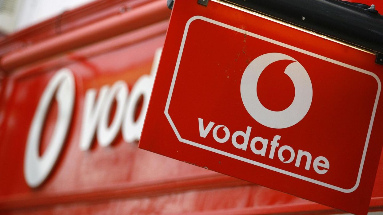 vodafone logo pictured on a sign outside of a retail store