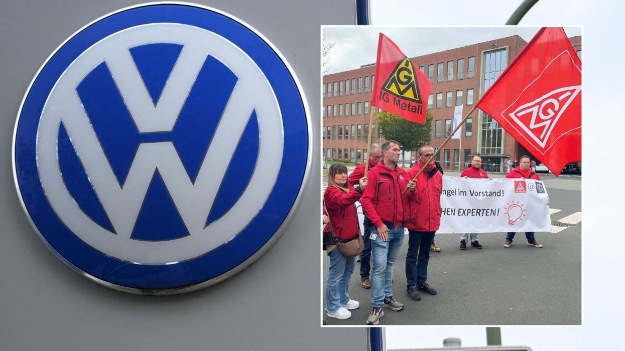 Volkswagen logo and union protesters outside the Kassel factory