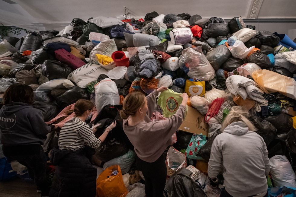 Volunteers at the Klub Orla Bialego (White Eagle Club) in Balham, south London, sift through donations made by members of the public, prior to their aid convoy setting off to Ukraine in aid of refugees fleeing the Russian invasion.
