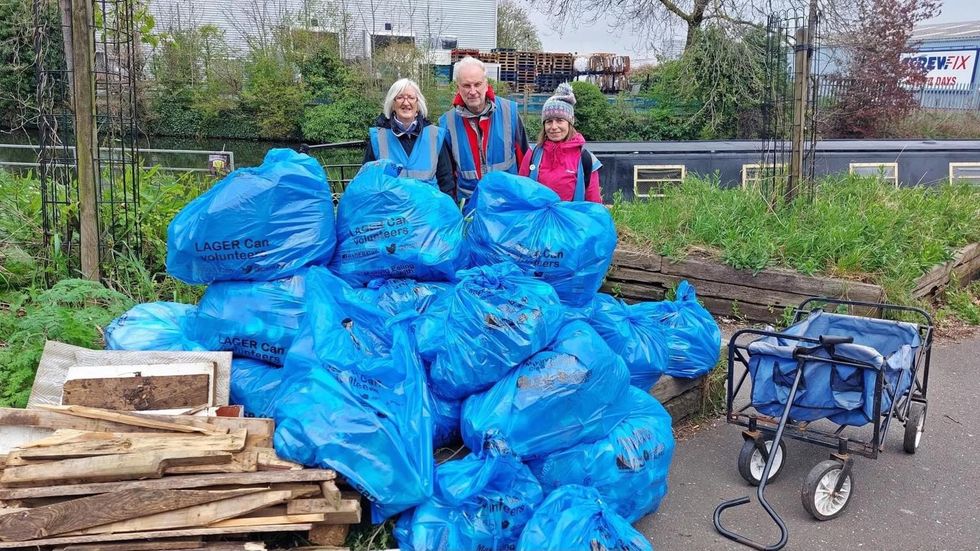 Volunteers with bags of rubbish