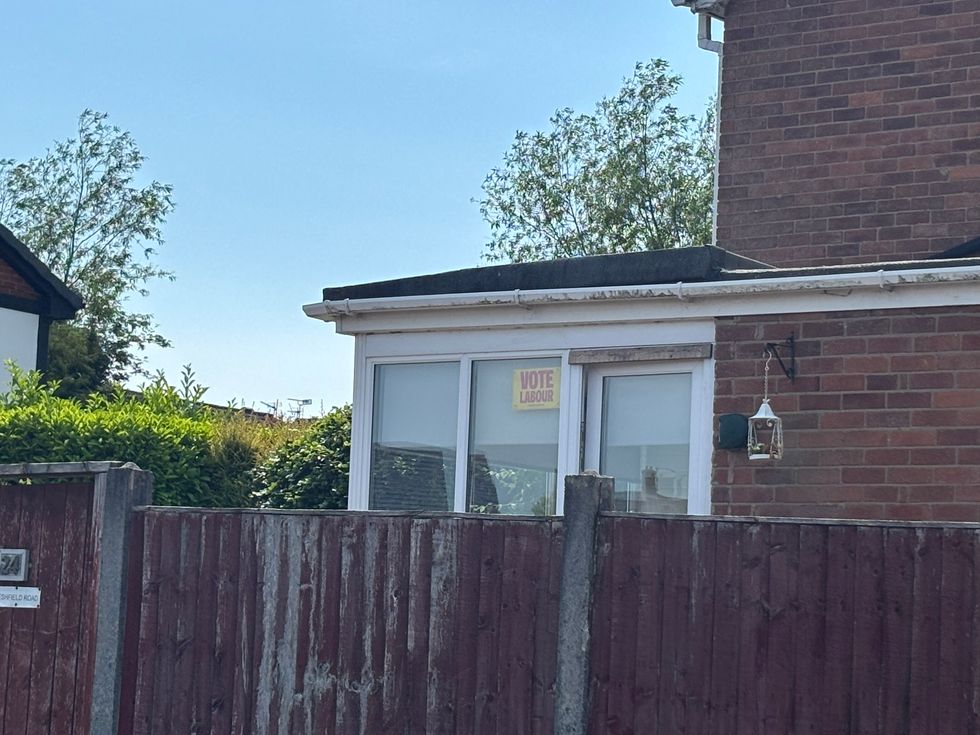 Vote Labour posted in window