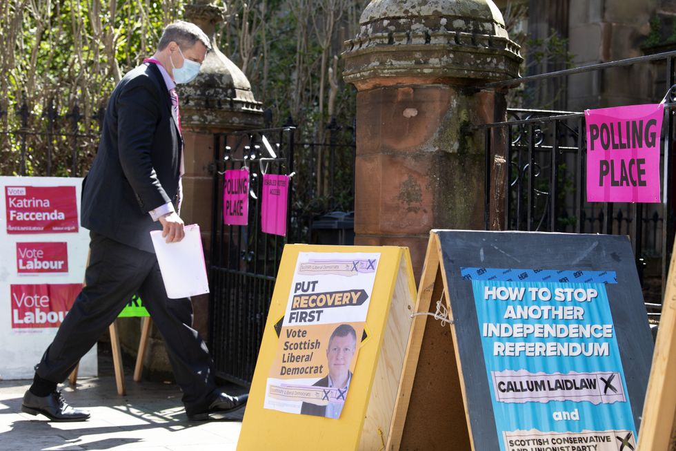 Voters arrive at the polling station at St James' Church, Edinburgh.