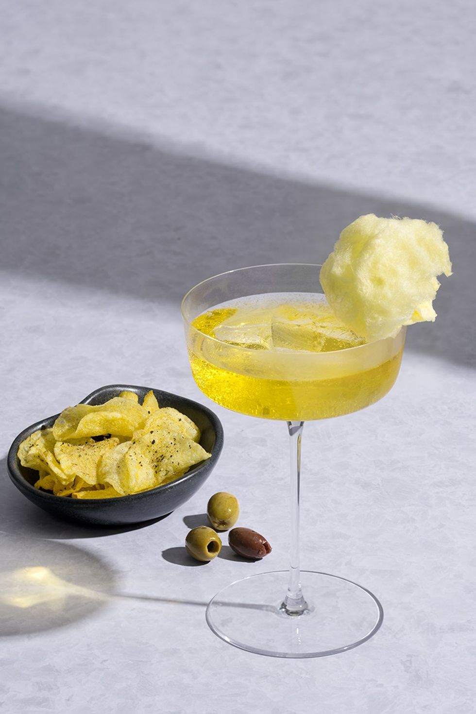Vueling in the Clouds cocktail, crisps and olives