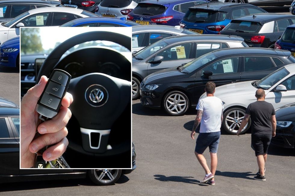 VW car key and people shopping for a new car