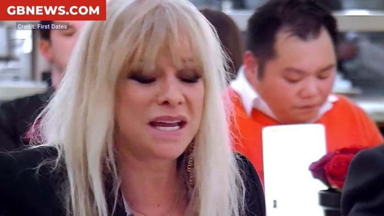 Ronnie Wood, 78, in awkward run-in with ex-wife Jo, 70, as pair reunite on family holiday