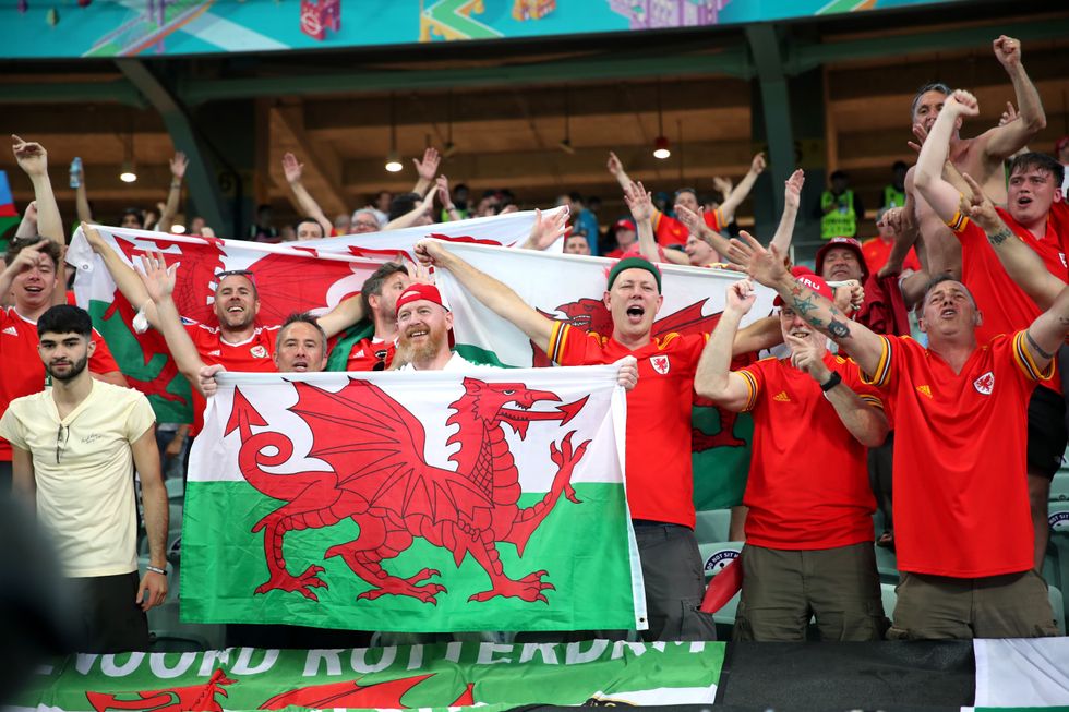 Wales fans celebrate inside the stadium after the match against Turkey