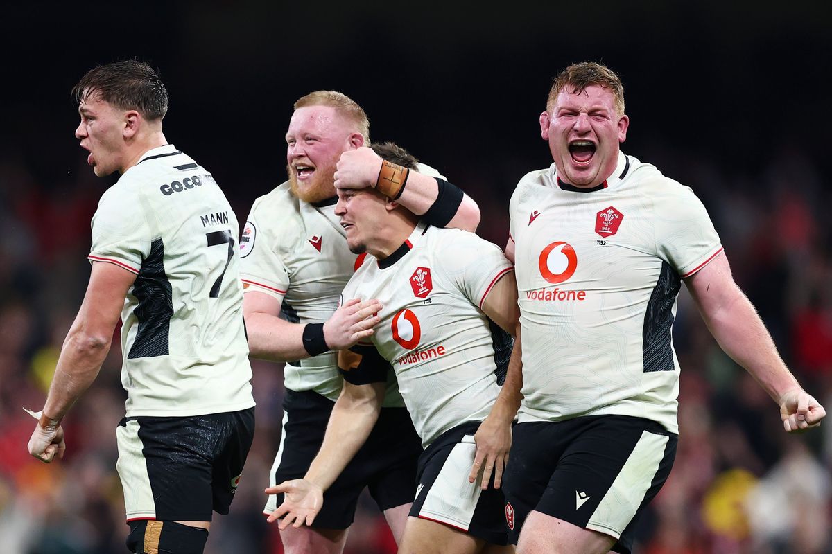 Wales national rugby union team celebrates on the pitch