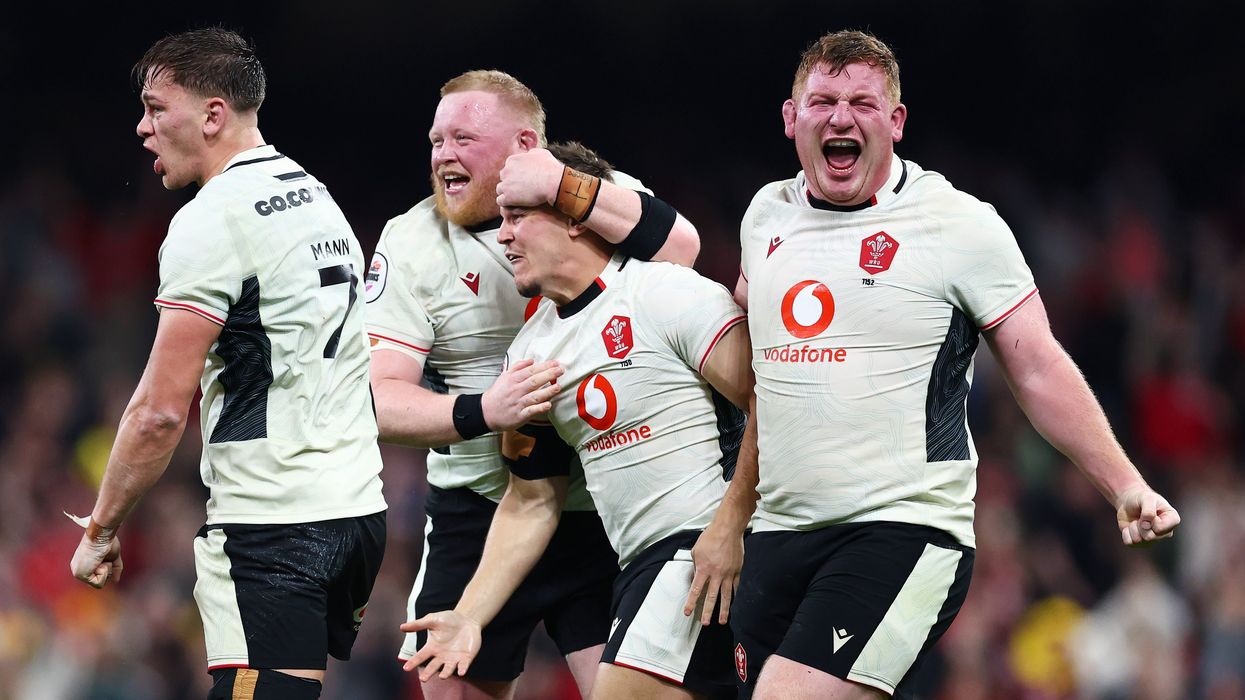 Wales national rugby union team celebrates on the pitch