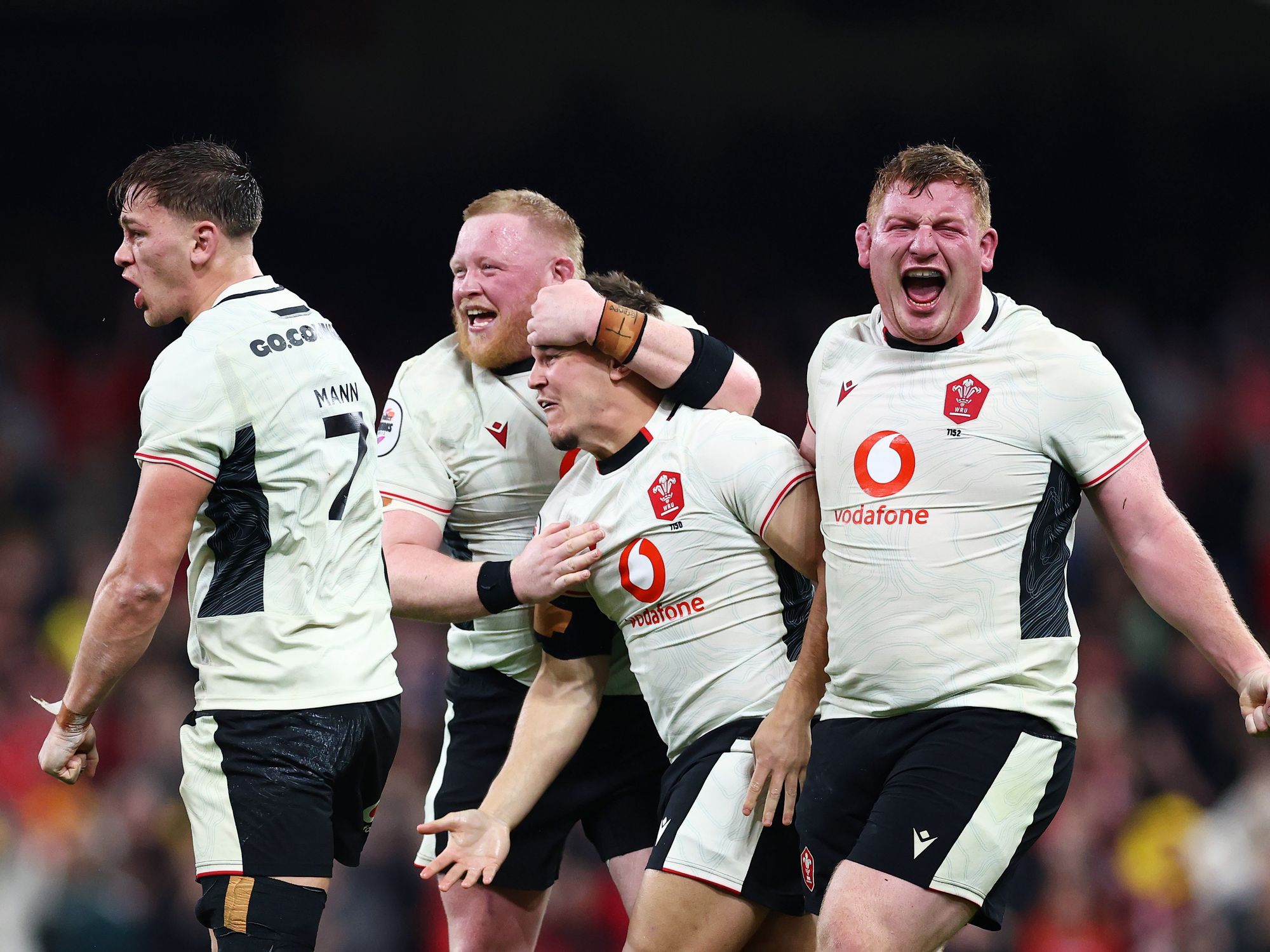 Wales national rugby union team celebrates on the pitch
