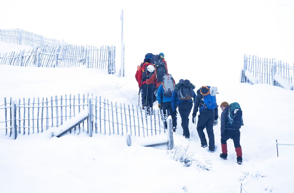 Walkers in snowy conditions in the Cairngorms National Park near Aviemore. Large areas of the country have been warned to expect severe conditions during the weekend, with snow forecast for Scotland and the south-east of England. Picture date: Saturday December 10, 2022.
