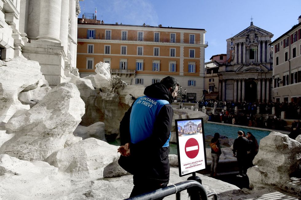 Wardens at the Trevi Fountain keep watch for would-be freeloaders