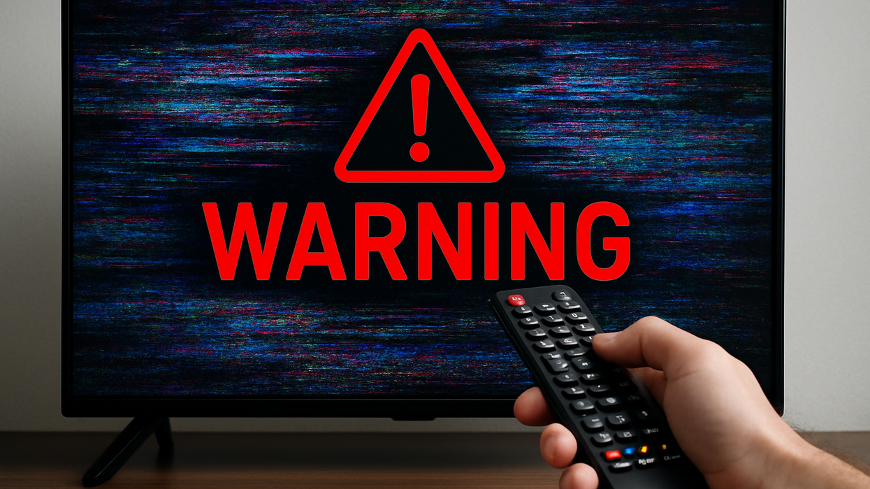 Warning across TV screen with hand holding remote