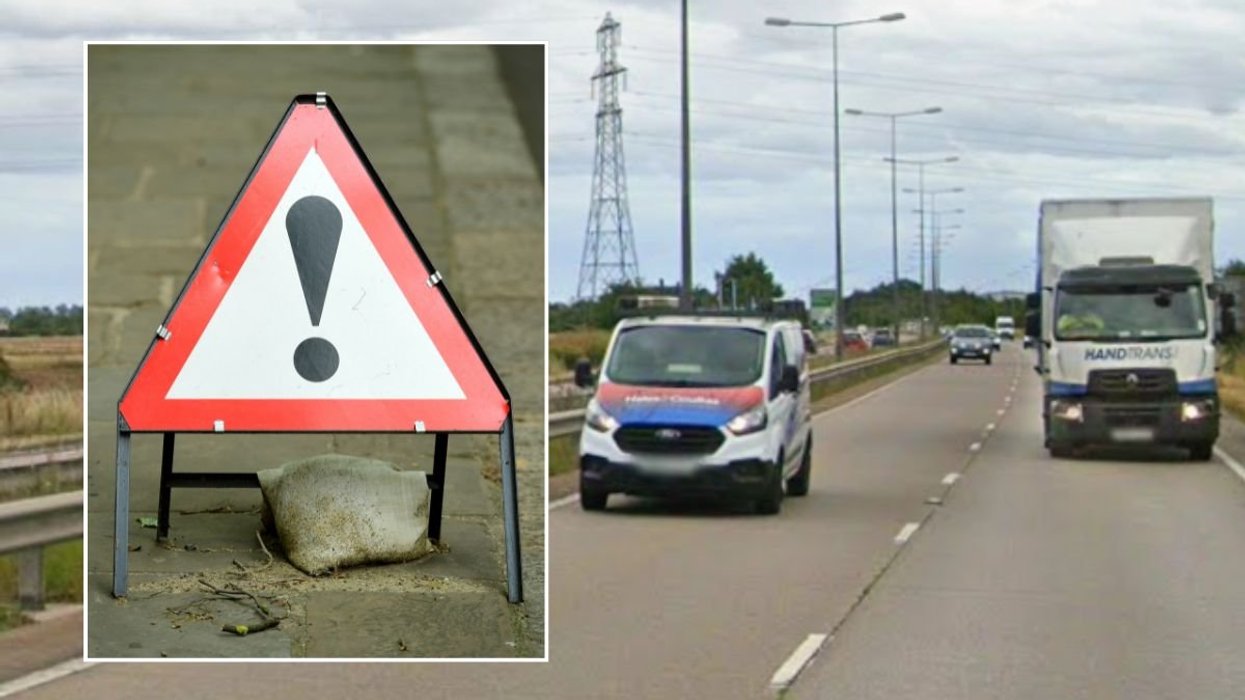 Warning road sign and the A180 near Grimsby