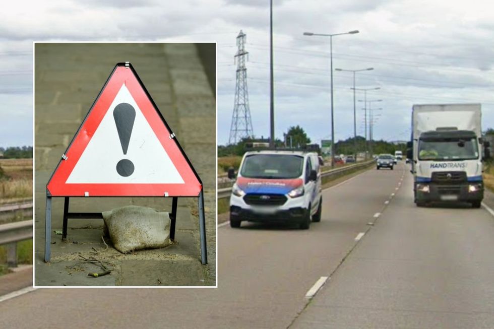 Warning road sign and the A180 near Grimsby