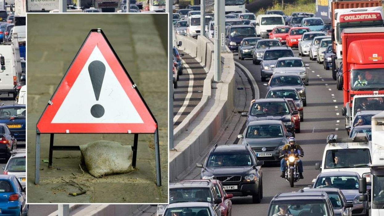 Warning sign and busy traffic