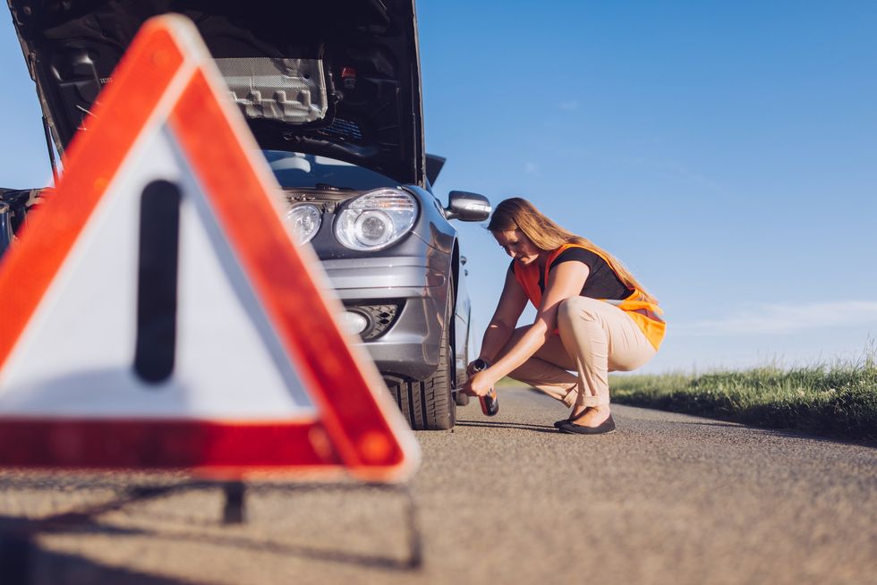 Warning triangle near broken down car