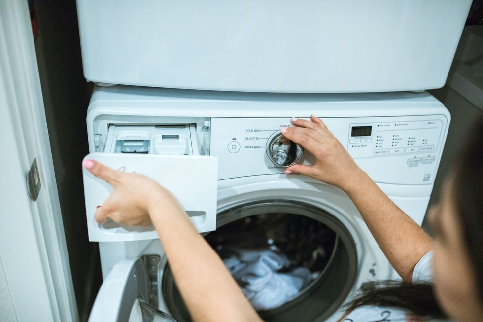 Washing machine with open drawer