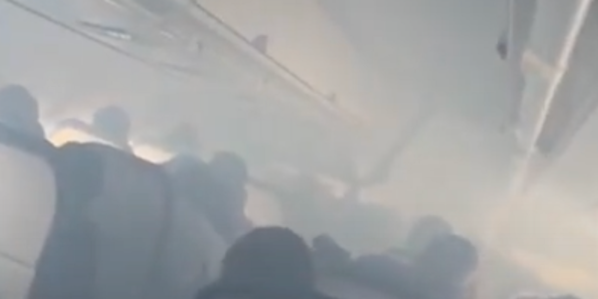 NextImg:Delta flight fills with 'smoke' as passengers forced to evacuate on emergency slides at Atlanta airport