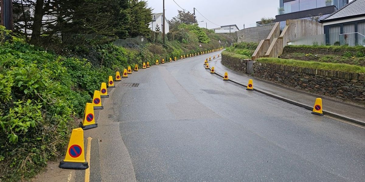 NextImg:Villagers deploy cones to deter tourists from 'chaotic' parking on main road as row erupts