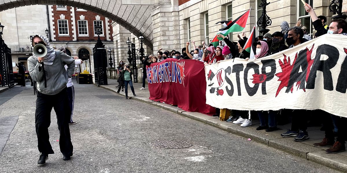 NextImg:Pro-Palestine protesters clash with police outside the Department for Business and Trade as 600 activists block government building