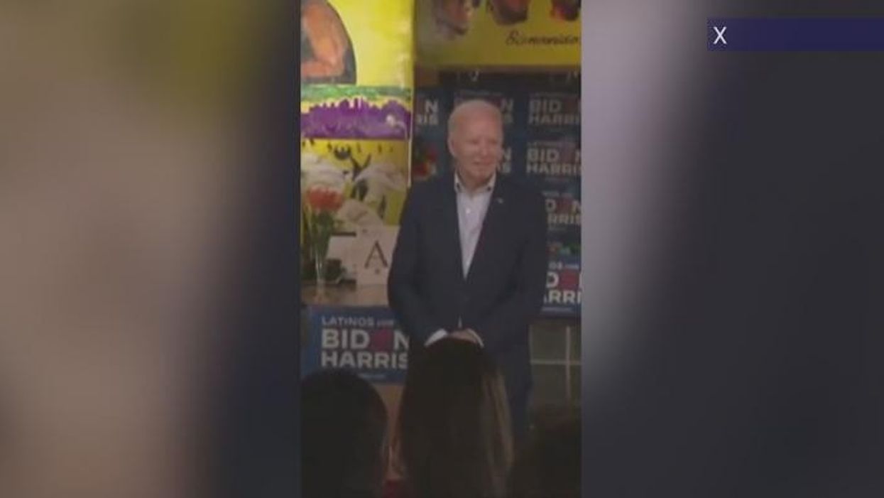 Joe Biden wanders off stage in bizarre moment after he 'couldn't resist little baby'