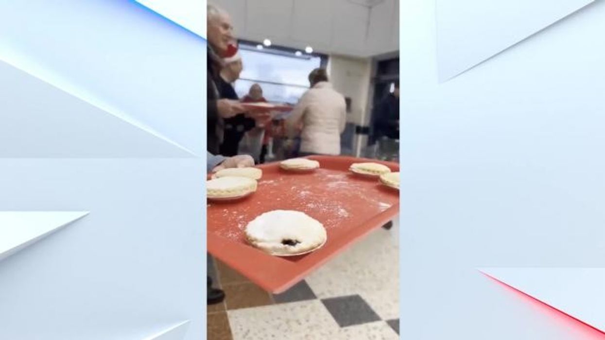 Angry voter confronts 'two-faced' Yvette Cooper as Home Secretary gives out mince pies while pensioners are 'freezing to death'