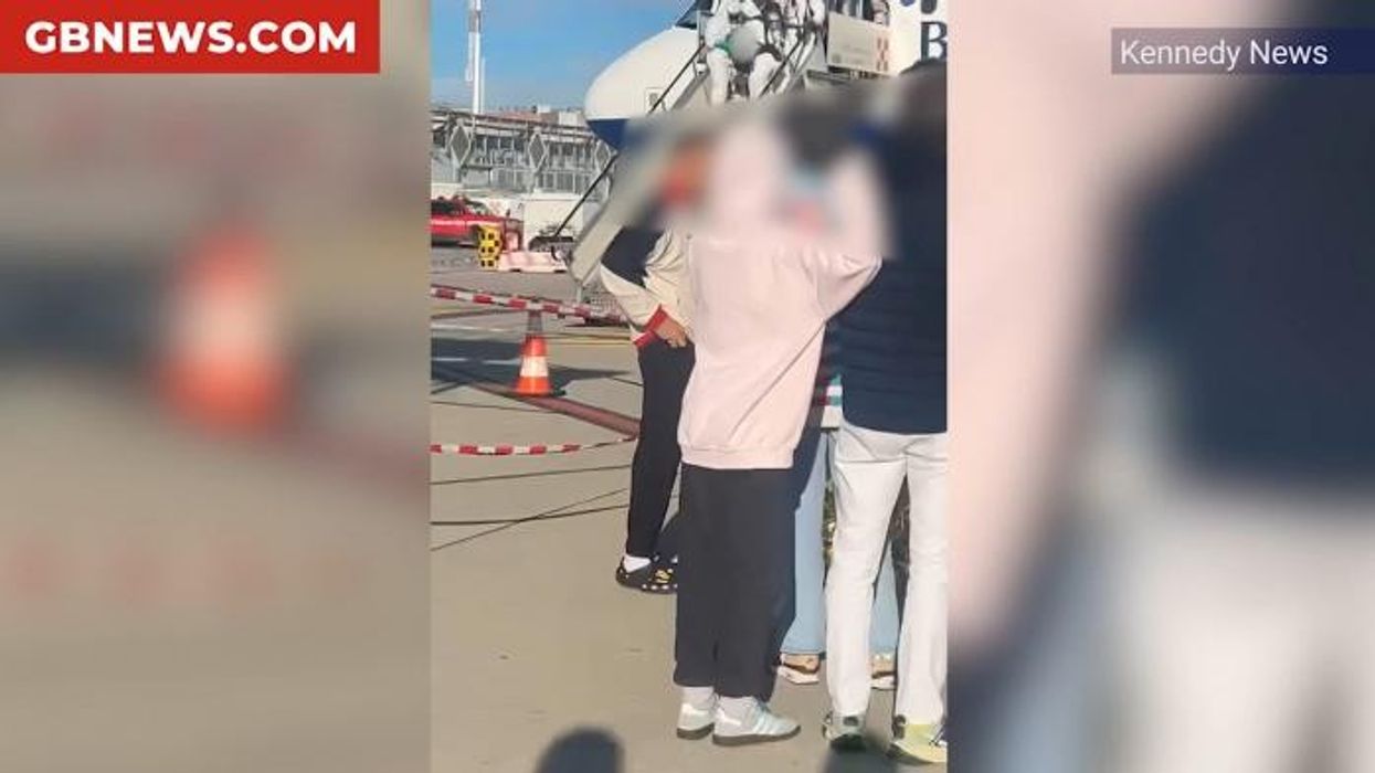 British Airways flight forced into emergency landing after cabin crew collapse on board due to 'toxic fumes' as hazmat suits rush to the scene