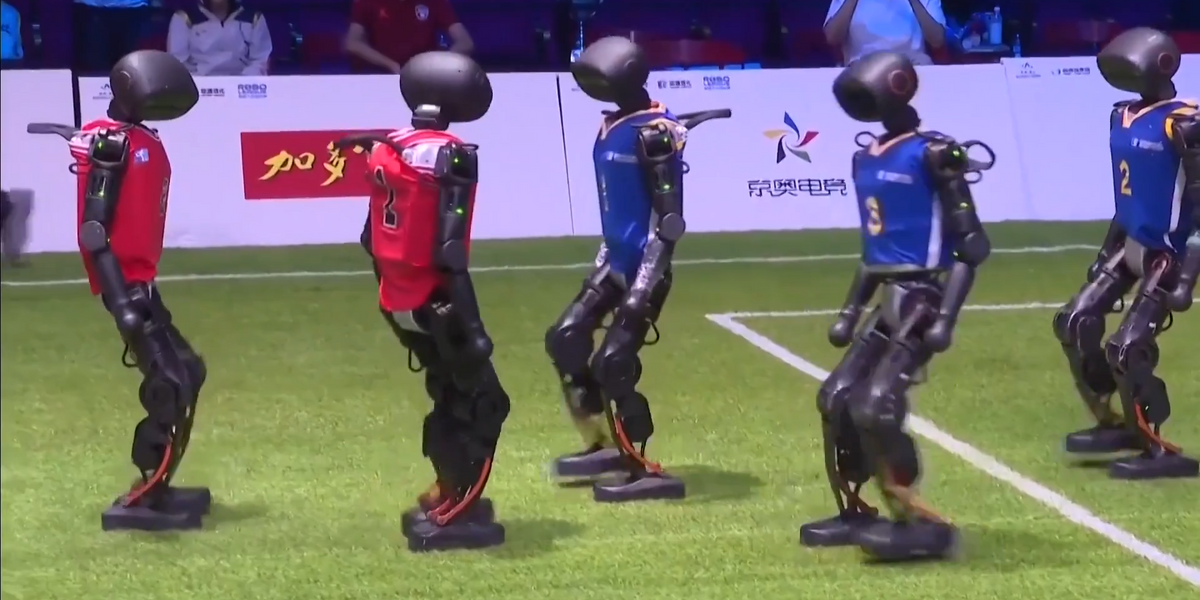 NextImg:WATCH: Beijing hosts world’s first AI robot football match – ‘Maybe a team England could beat!’