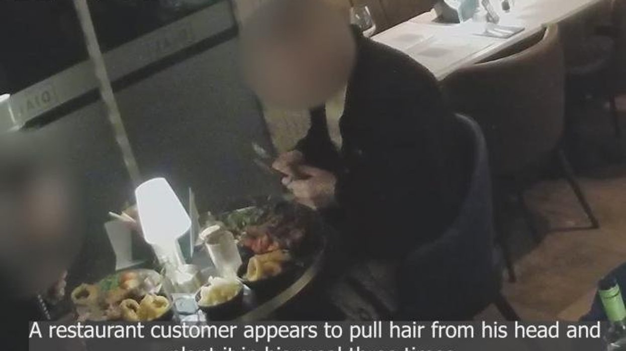 'Aggressive' diners caught on CCTV 'planting hair in their food' before refusing to pay £165 bill