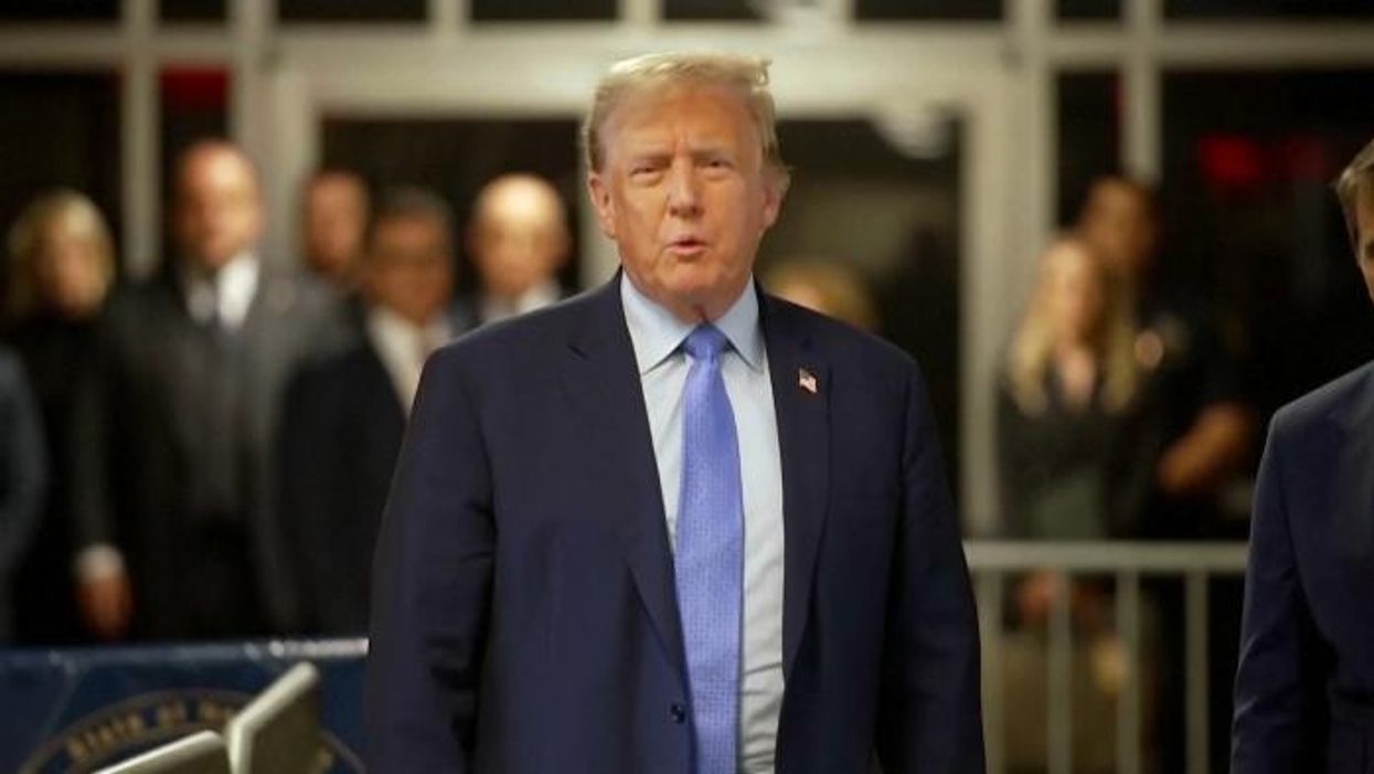 Donald Trump sits with eyes closed and slumps in chair as court hears Cohen testimony in hush money trial