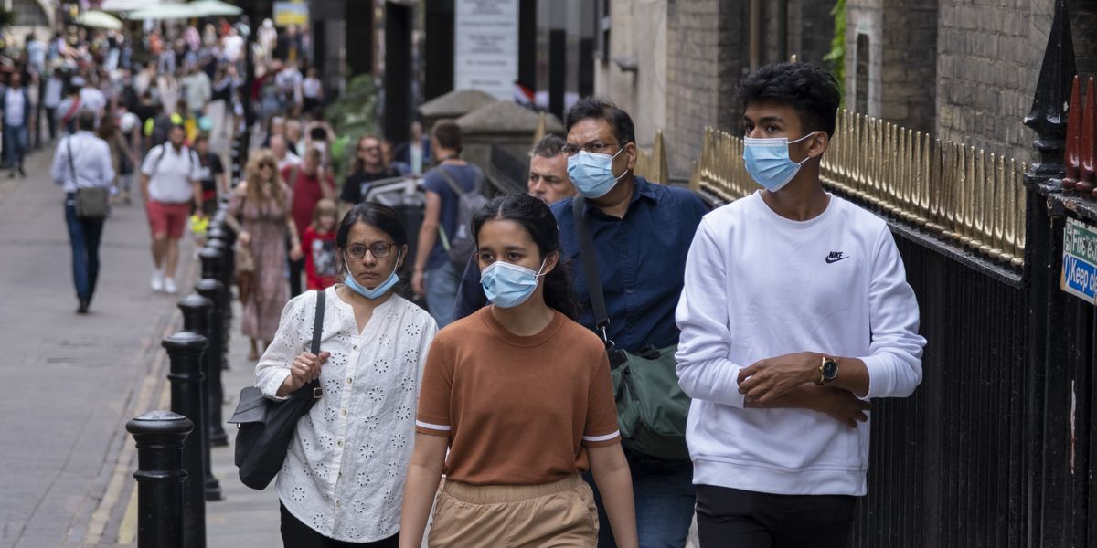 NextImg:Covid face mask return warning issued over 'major surge in infections'