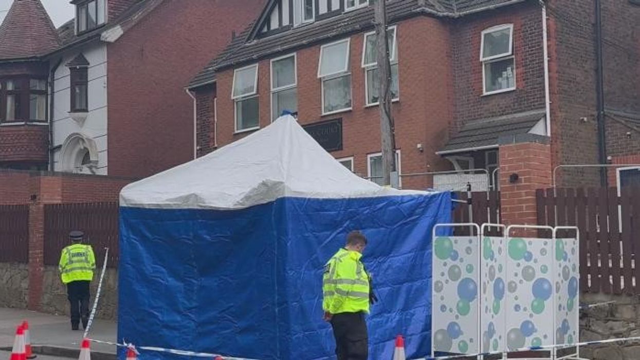 Woman rushed to hospital with 'serious injuries' after being stabbed outside primary school