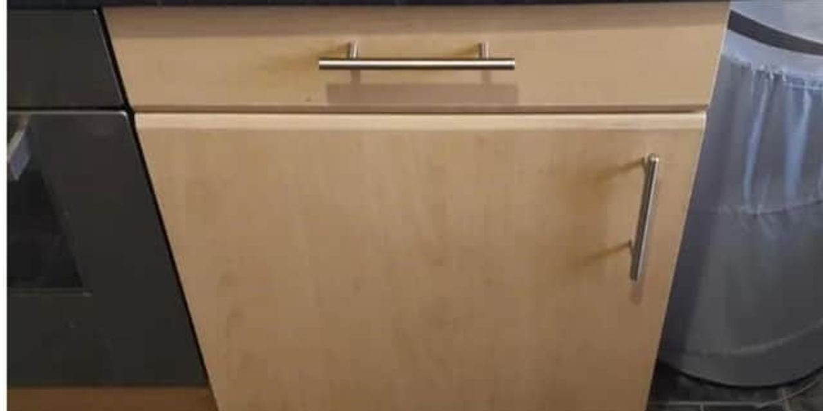 NextImg:Police discover man on the run hidden inside tiny kitchen cupboard