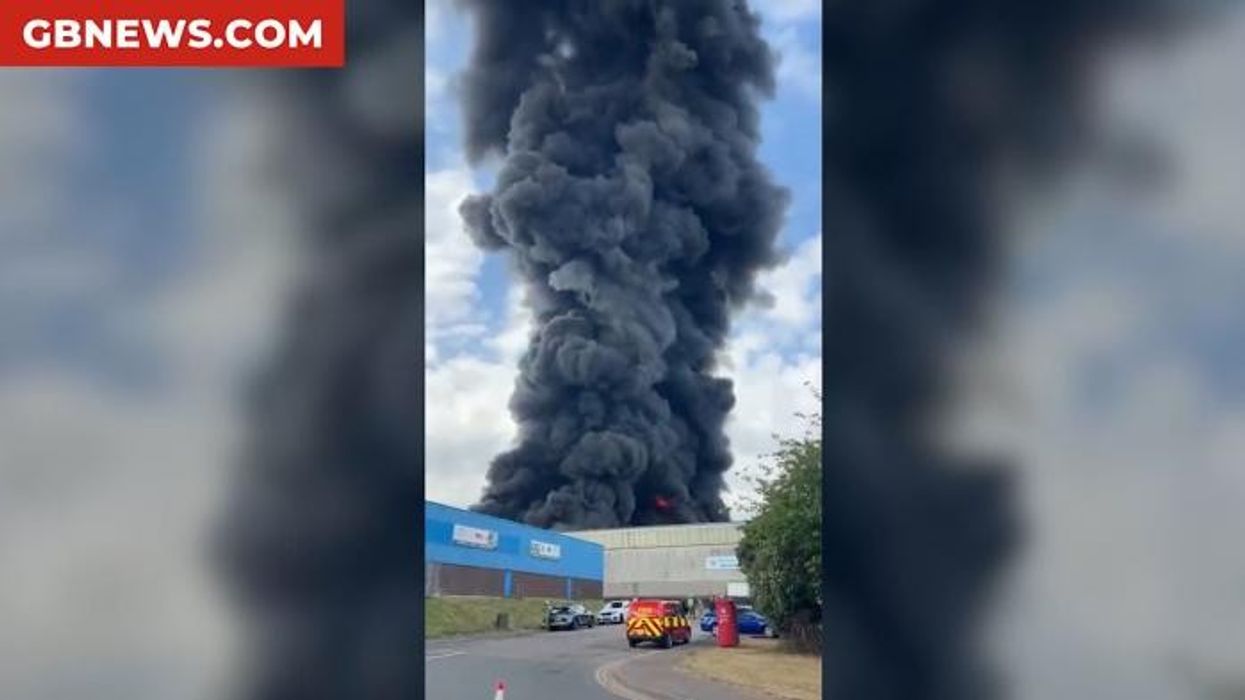 Major incident declared after huge fire engulfs recycling warehouse as firefighters rush to tackle raging inferno