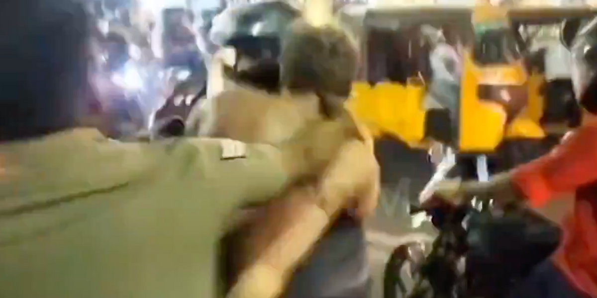 NextImg:Semi-naked British 'navy sailor' dragged away by Indian police after BITING motorcyclist in middle of the road