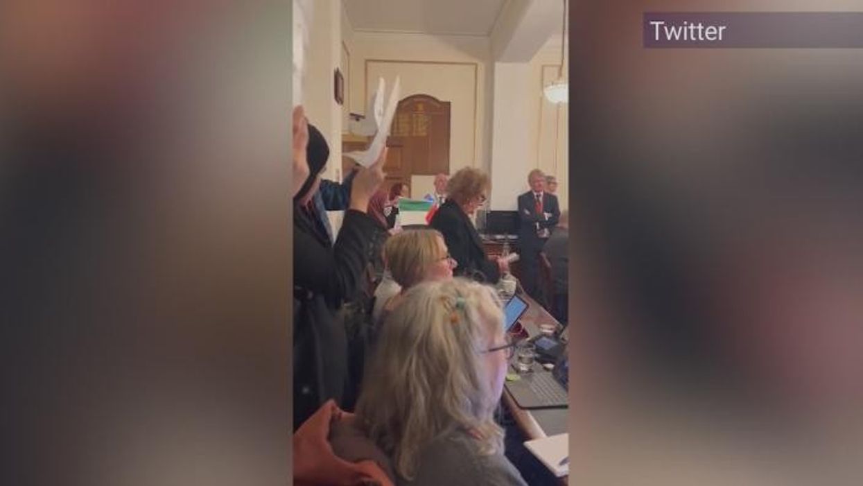 'It's Chorley not b****y Gaza!' Pro-Palestine protesters 'hijack' council meeting as scuffle causes chaos