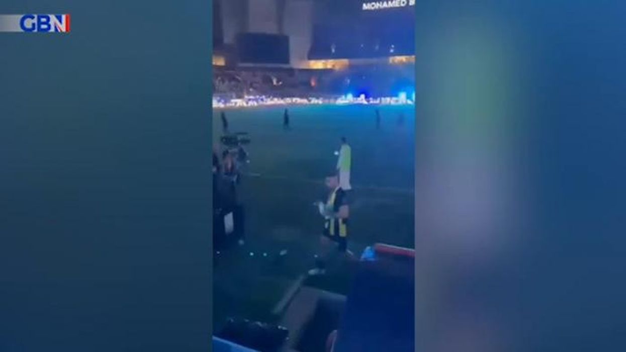 Shocking moment Saudi fan WHIPS football player after devastating defeat