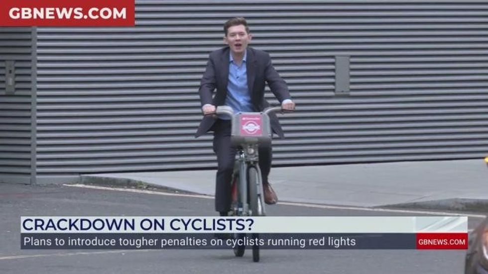 'None of your business!' Moment GB News reporter confronts London cyclists for running red lights