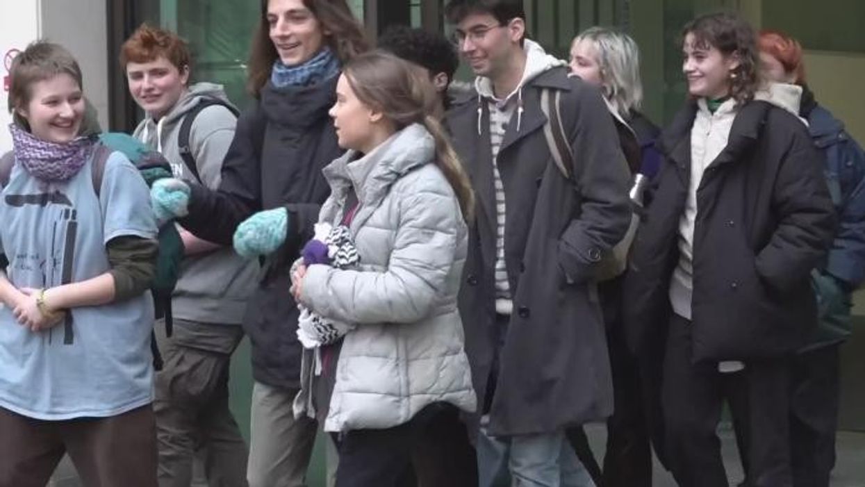 Greta Thunberg joyfully celebrates outside court after public order charge is thrown out as lawyer threatens to sue police
