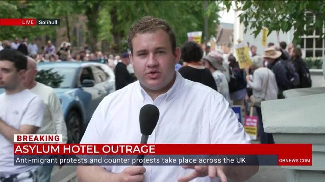 'This is NOT the way!' Counter-protester defends migrants against 'unkind' demonstration outside Solihull hotel