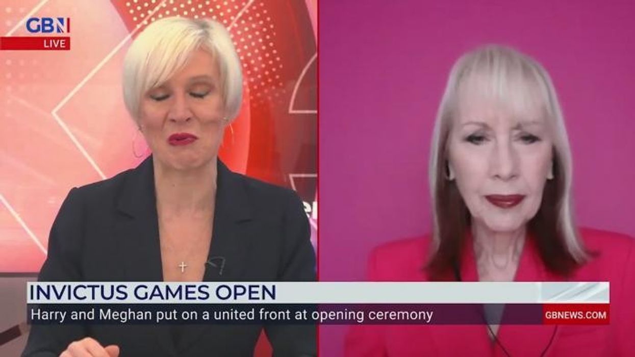 'It's overkill!' Meghan Markle 'rebranding' to 'besotted wife' persona after packing on PDA at Invictus Games ceremony: 'She's less professional'