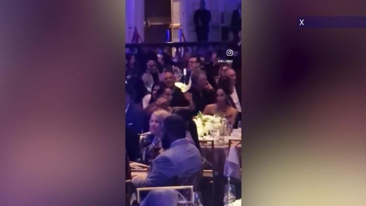 Meghan Markle dances at glitzy gala alongside her famous friends in £31,500 outfit