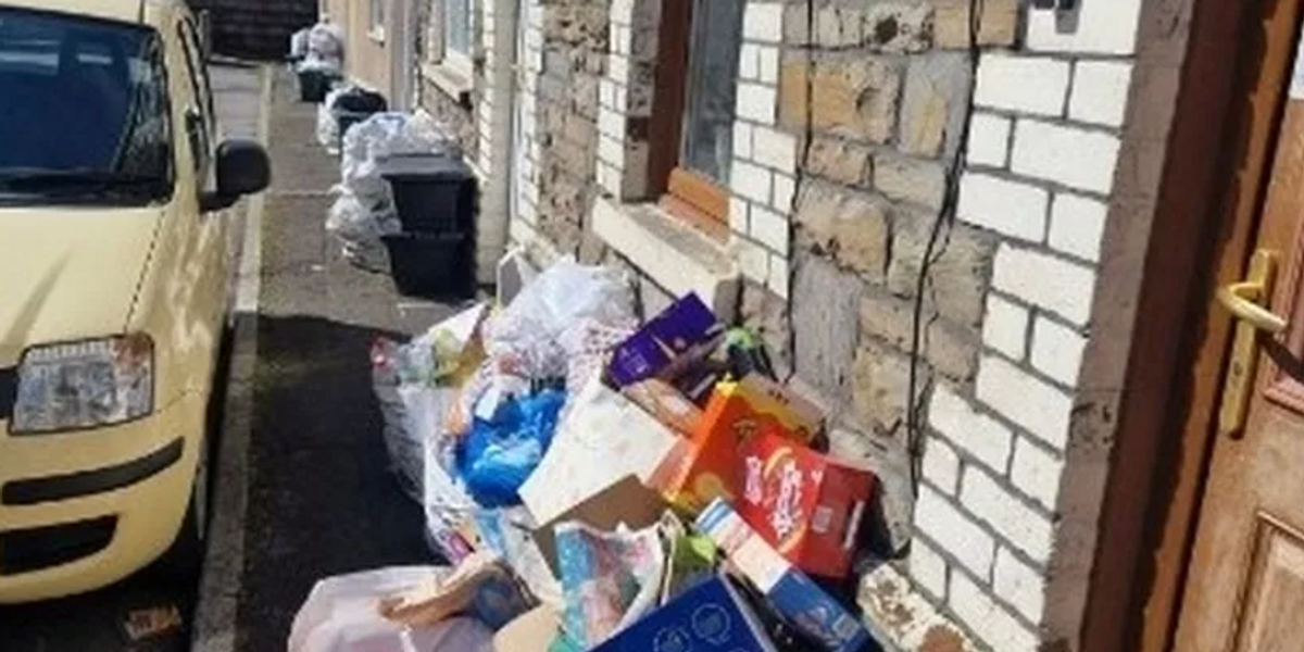 NextImg:Parking row leaves street 'swimming in rubbish' after month of no bin collections