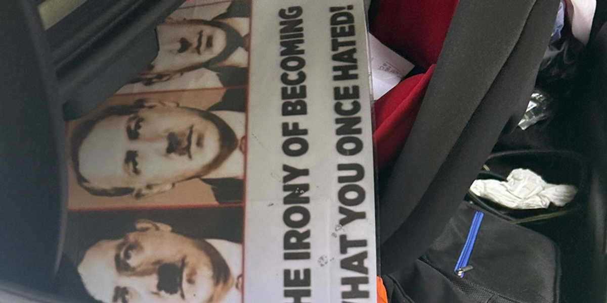 NextImg:Palestine activist with Hitler placards car boot RELEASED by police just 10 minutes later... before he then REJOINED protest