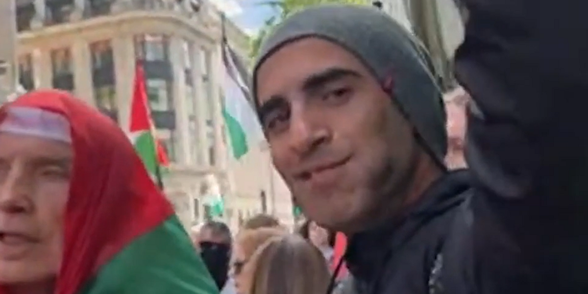 NextImg:Anti-Hamas activist arrested for racism after waving BANANA at pro-Palestine protesters