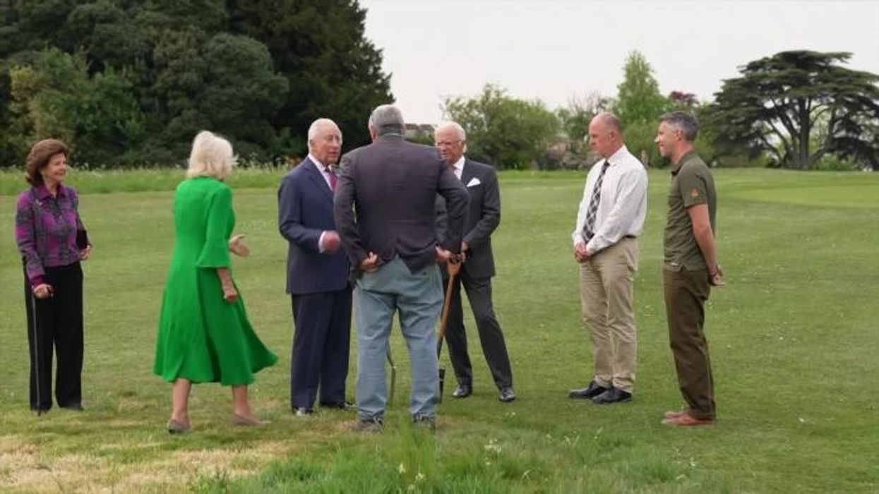 Queen Camilla caught making cheeky gesture to get King Charles moving