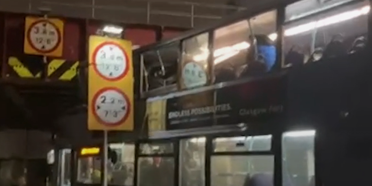 NextImg:Eight people injured as bus roof TORN OFF following railway bridge crash