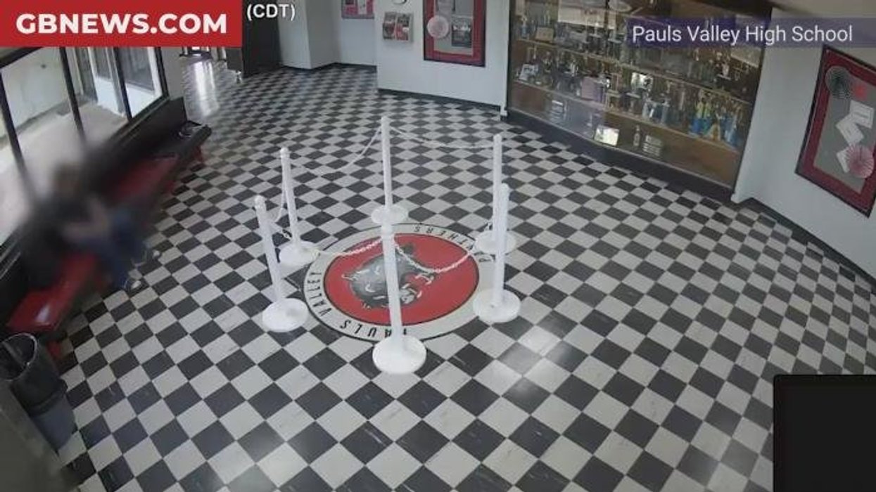 Watch the moment heroic US school headteacher tackles and pins down armed shooter